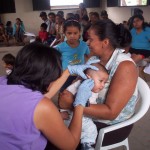 Ana Checking a baby's ear