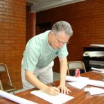 John Lamon signing contract for purchase of land
